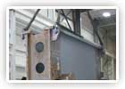 Crane moving a part into the fabrication pit